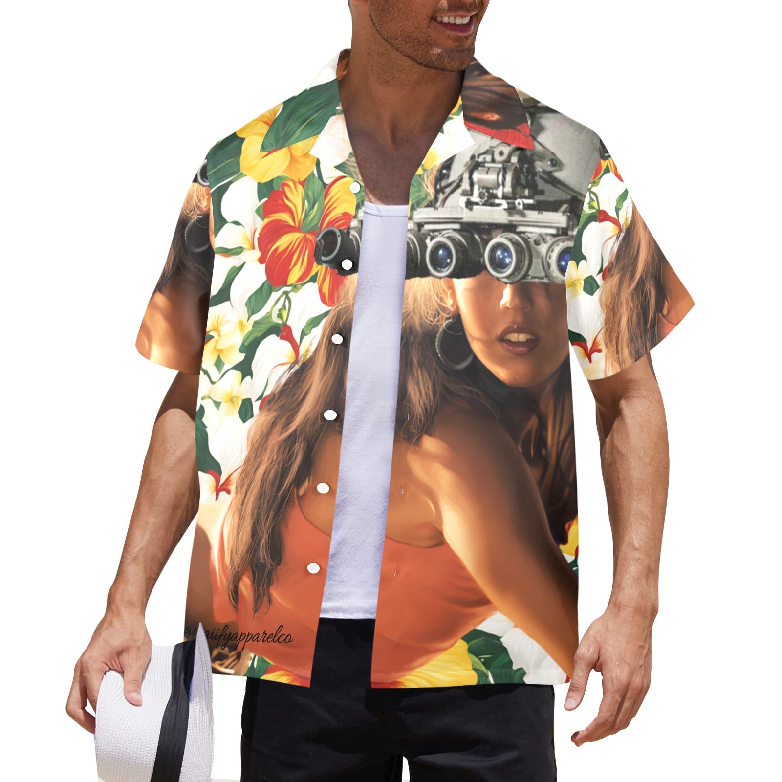 A man wearing a multicolored Hawaiian shirt with a vibrant floral and eye graphic design, and a white hat.